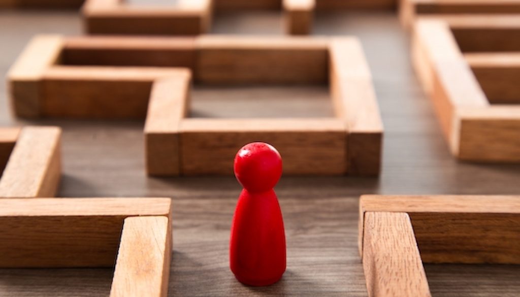 concept photo of standing in a maze and looking for the best way