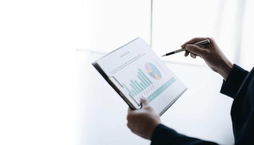 Professional businessman or investor looking at the company chart, trying to analyse the budget.