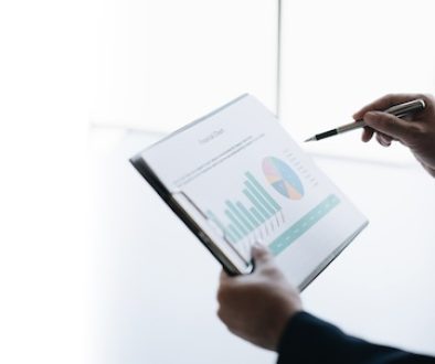 Professional businessman or investor looking at the company chart, trying to analyse the budget.