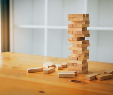 Wood blocks stacks game with planning strategy of project management.
