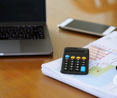 computer-on-table-with-smartphone-documents-and-c-2024-12-07-12-44-41-utc